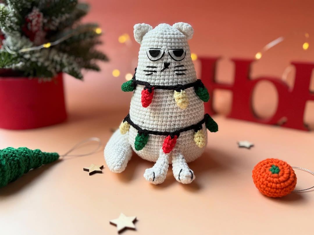 Handmade crochet cat with Christmas tree decorations