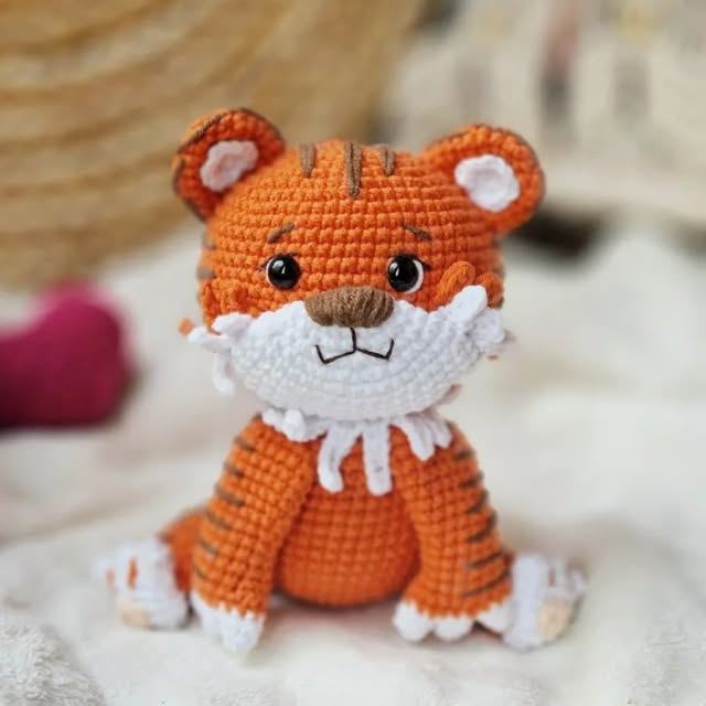 Handmade crochet tiger with orange stripes